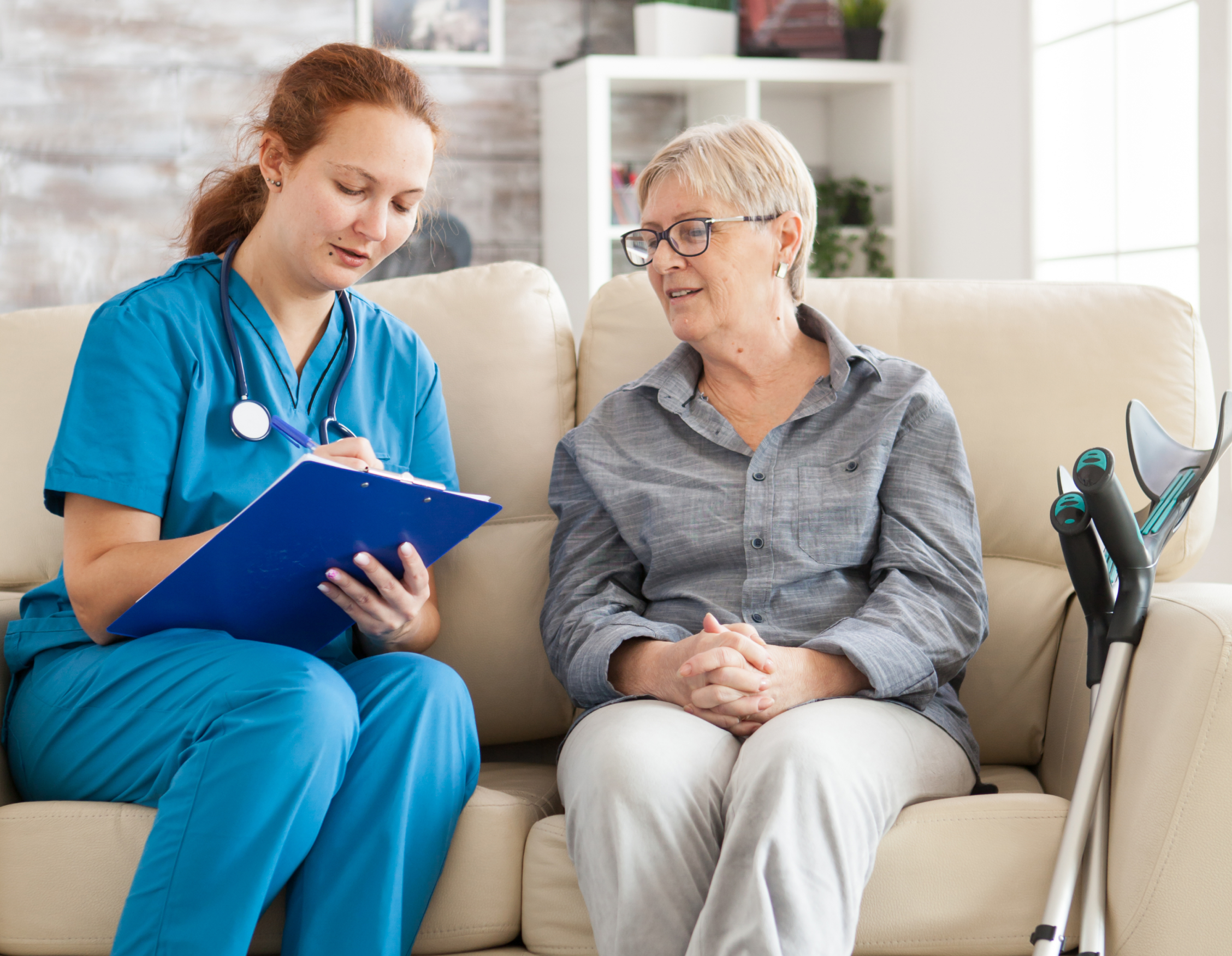 Nurse speaking with elderly client